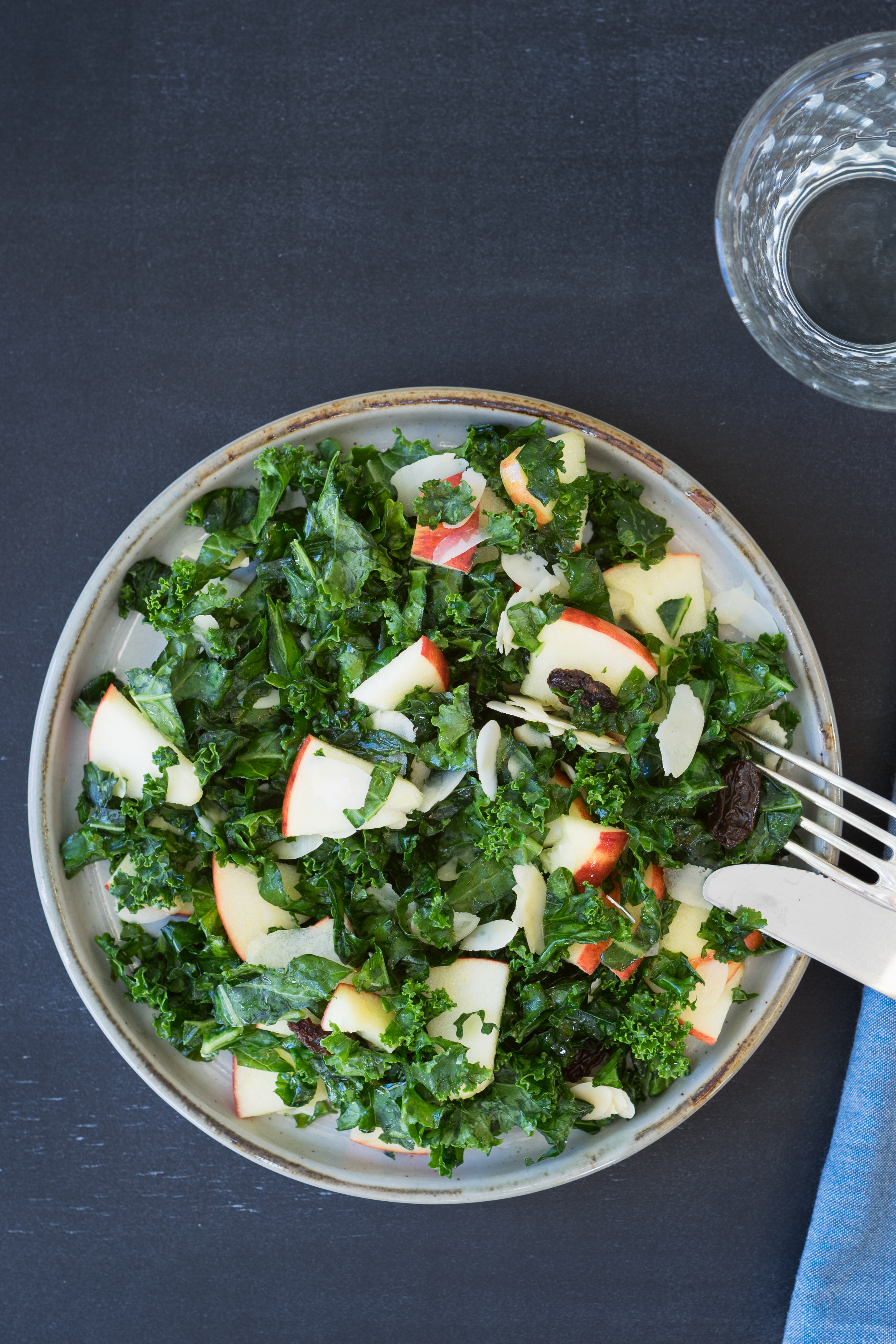 Overhead view of kale salad with apples