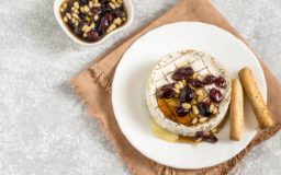 Baked brie cheese with dried cranberries Kimberton Whole Foods