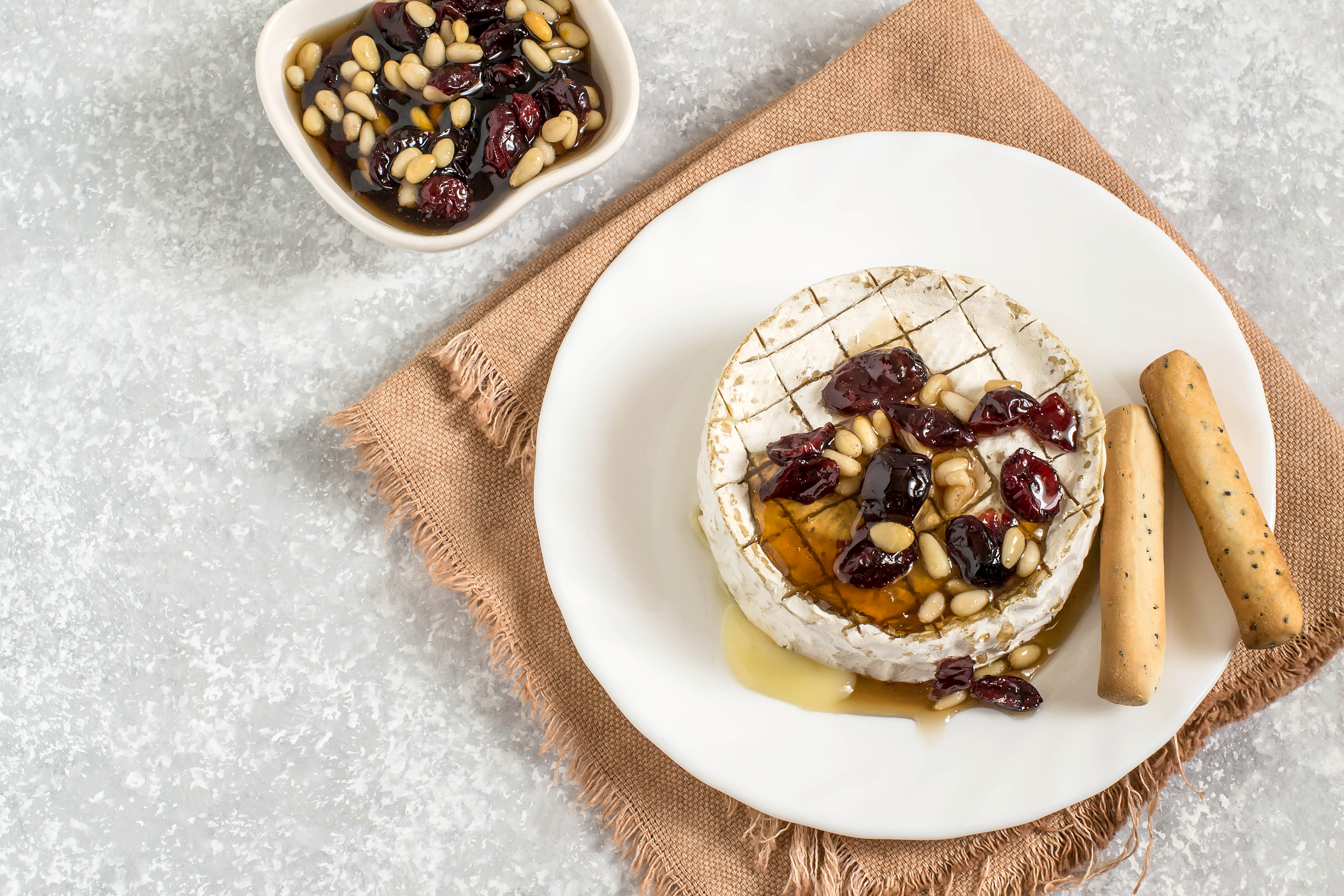 Baked brie cheese with dried cranberries Kimberton Whole Foods